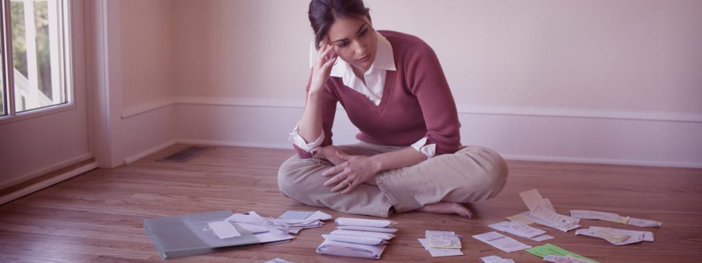 Woman with CRA debt facing financial statements