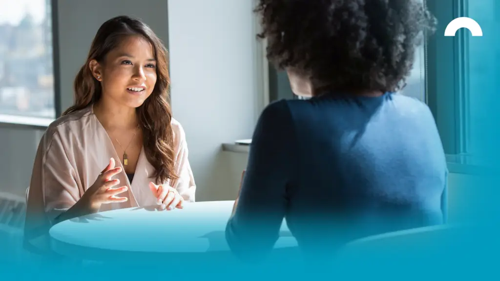 Woman sitting down with a consumer debt counsellor to discuss alternatives to filing bankruptcy.