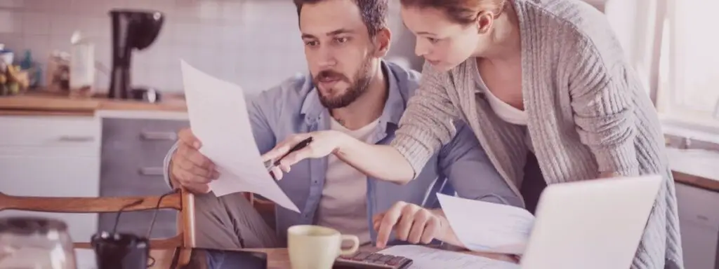 Couple reviewing financial statements