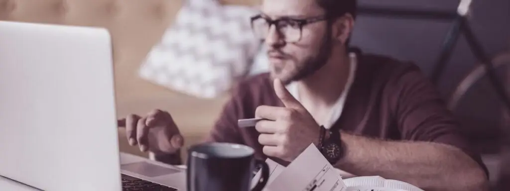 Student confused when reviewing his student debt payments.